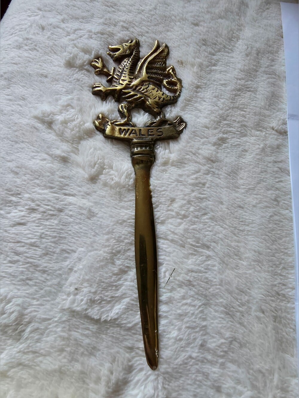 Vintage brass letter opener featuring the Welsh dragon and the word "Wales"